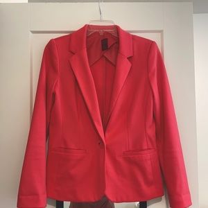 Bright pink women’s blazer.
